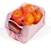 Fruit packaging in flow pack with net film and cardboard tray