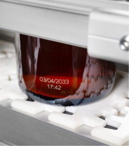 laser coding on glass bottle by Markem-Imaje